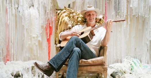 Max-Sitting-w-Guitar-jeans_cropped-e1442838406976-600x311